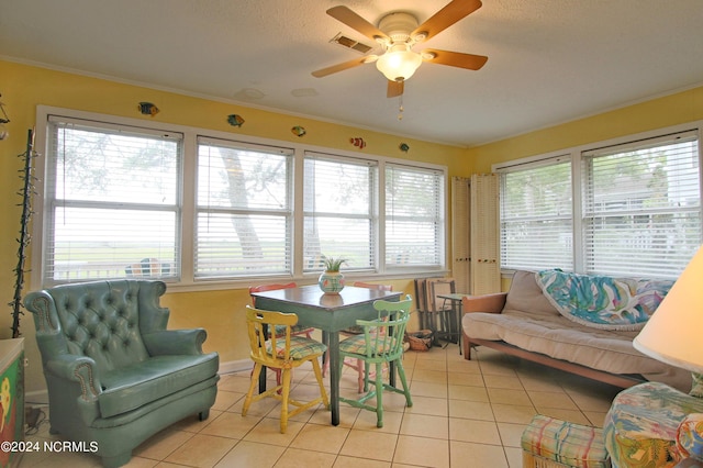 interior space with ceiling fan