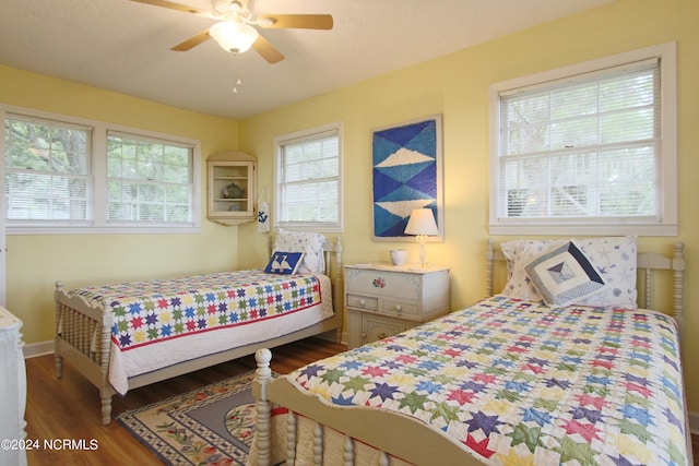 bedroom featuring dark wood-type flooring and ceiling fan