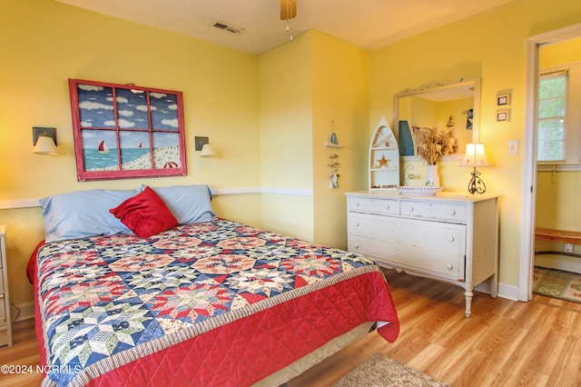 bedroom with hardwood / wood-style floors and ceiling fan