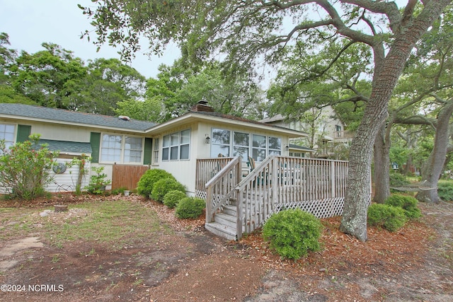 ranch-style house with a deck