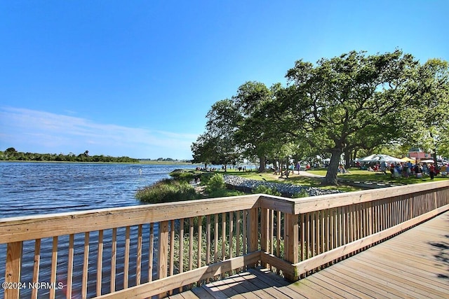 wooden terrace with a water view