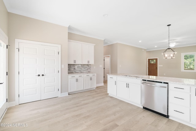 kitchen with pendant lighting, light wood-type flooring, tasteful backsplash, white cabinetry, and stainless steel dishwasher