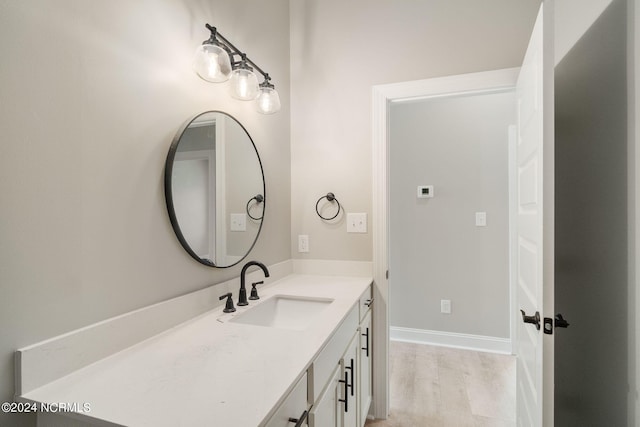 bathroom featuring vanity and hardwood / wood-style floors