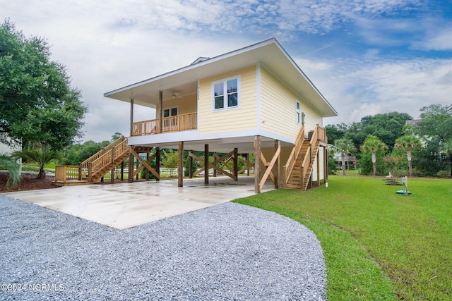 exterior space with a front yard and a carport