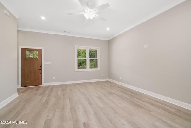 interior space featuring ceiling fan, light wood-type flooring, and ornamental molding