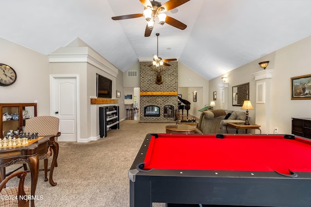 playroom featuring ceiling fan, carpet floors, visible vents, vaulted ceiling, and a brick fireplace