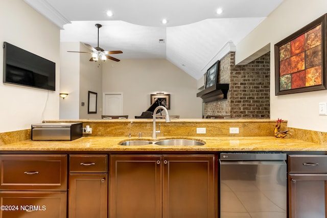 kitchen featuring dishwasher, ceiling fan, light stone counters, vaulted ceiling, and a sink