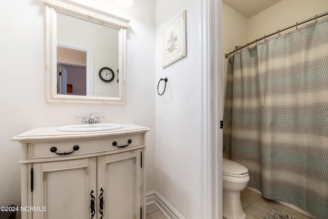 full bath featuring curtained shower, tile patterned flooring, vanity, and toilet