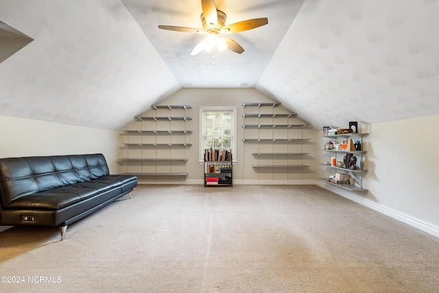 bonus room featuring carpet floors, baseboards, vaulted ceiling, and a ceiling fan