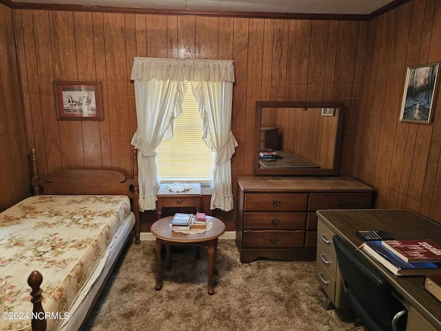 bedroom featuring wood walls and dark colored carpet