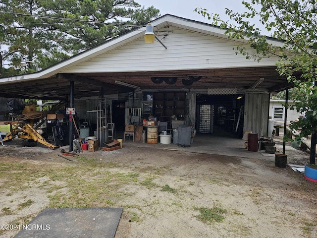 exterior space featuring a pole building and a carport