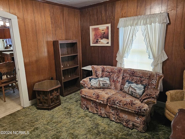 carpeted living room featuring wood walls