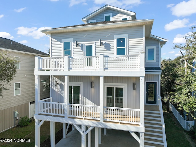 back of property featuring a balcony