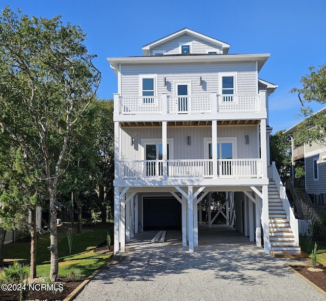 beach home featuring a carport and covered porch