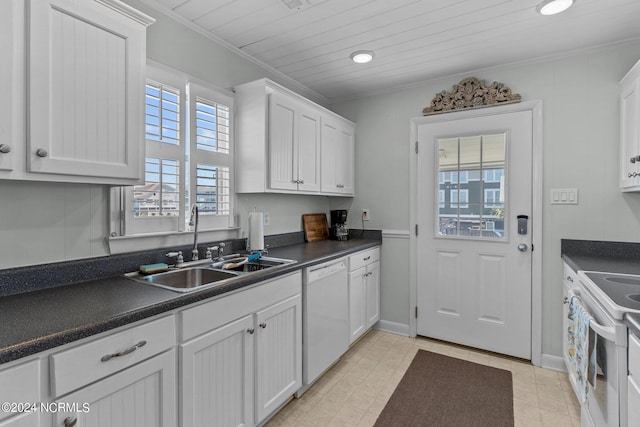 kitchen featuring white cabinets, white appliances, ornamental molding, and sink