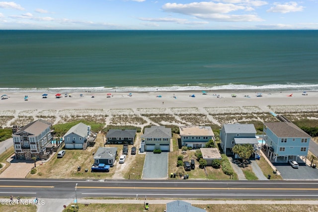 aerial view with a water view and a view of the beach