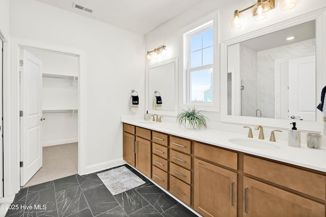 bathroom featuring vanity and walk in shower