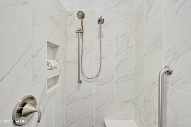 bathroom featuring a tile shower