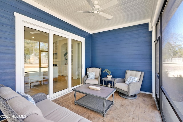 sunroom / solarium with ceiling fan