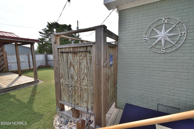 view of outbuilding featuring a yard