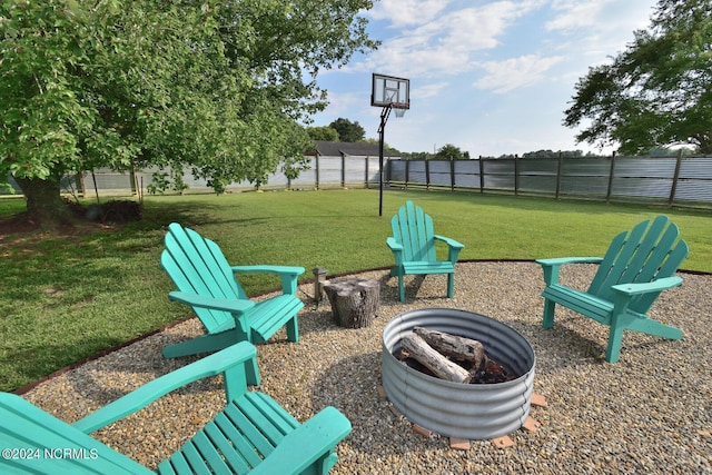 view of yard featuring an outdoor fire pit