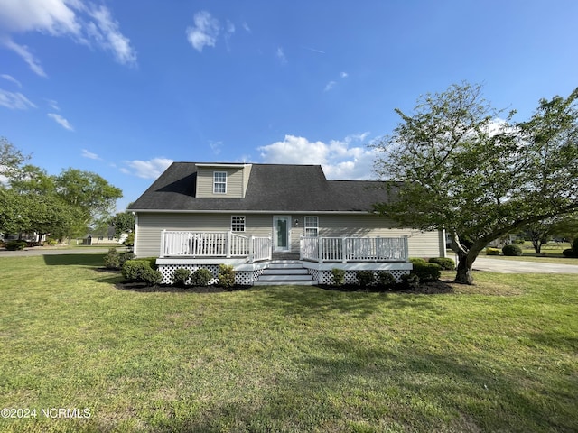 view of front facade featuring a front lawn and a deck