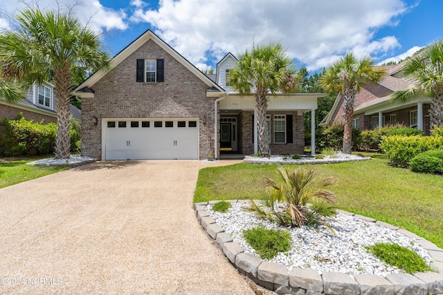 view of front of property featuring a garage and a front yard