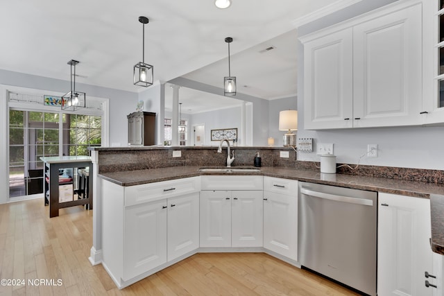 kitchen with dishwasher, pendant lighting, and white cabinetry