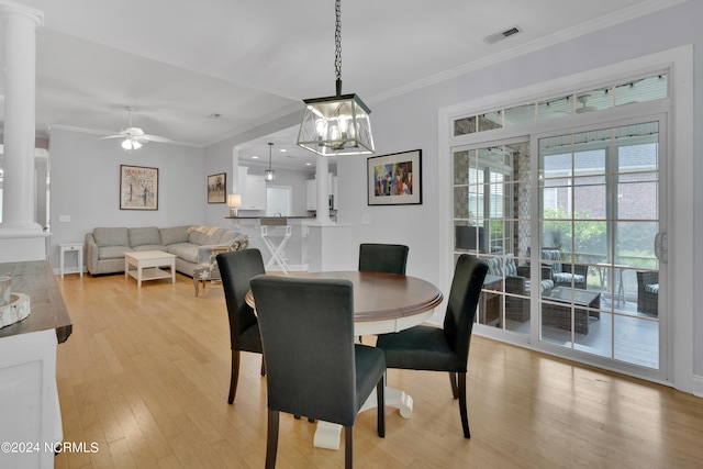 dining room featuring ceiling fan, light hardwood / wood-style flooring, and crown molding