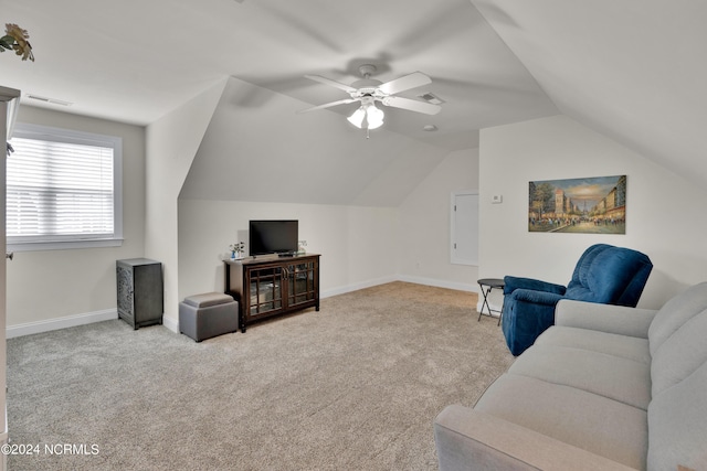 carpeted living room featuring vaulted ceiling and ceiling fan