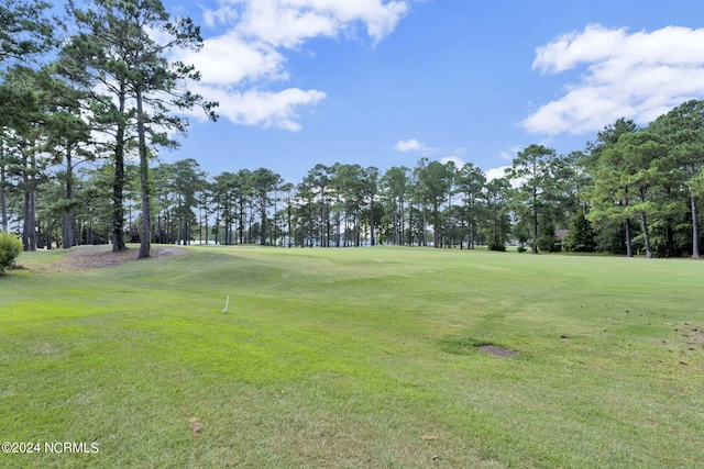 view of home's community featuring a lawn