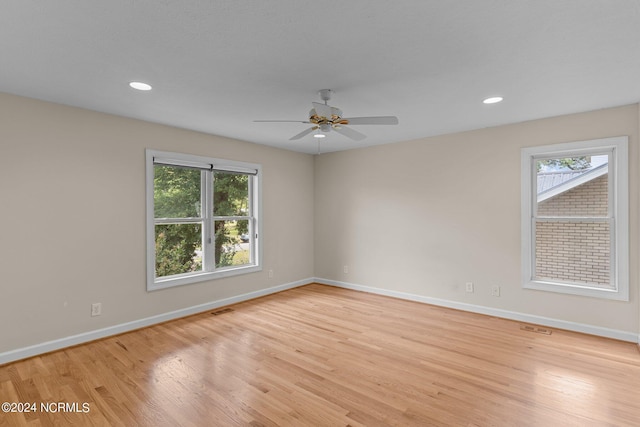 unfurnished room featuring light wood-type flooring and ceiling fan