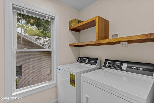 clothes washing area featuring washing machine and clothes dryer