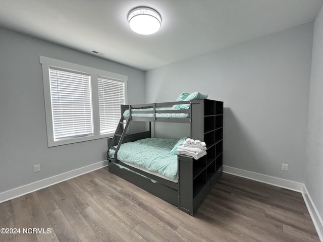 bedroom with hardwood / wood-style flooring