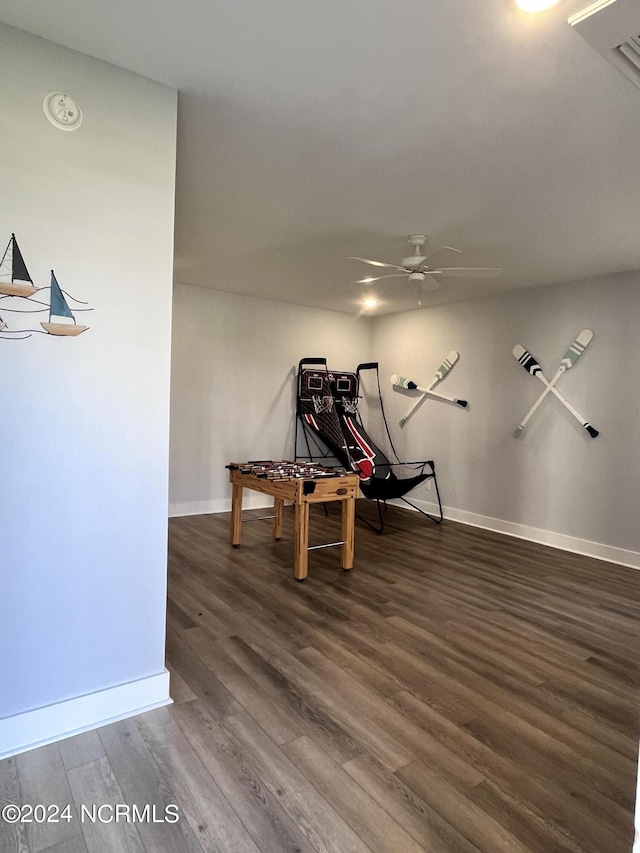 recreation room featuring ceiling fan and dark wood-type flooring