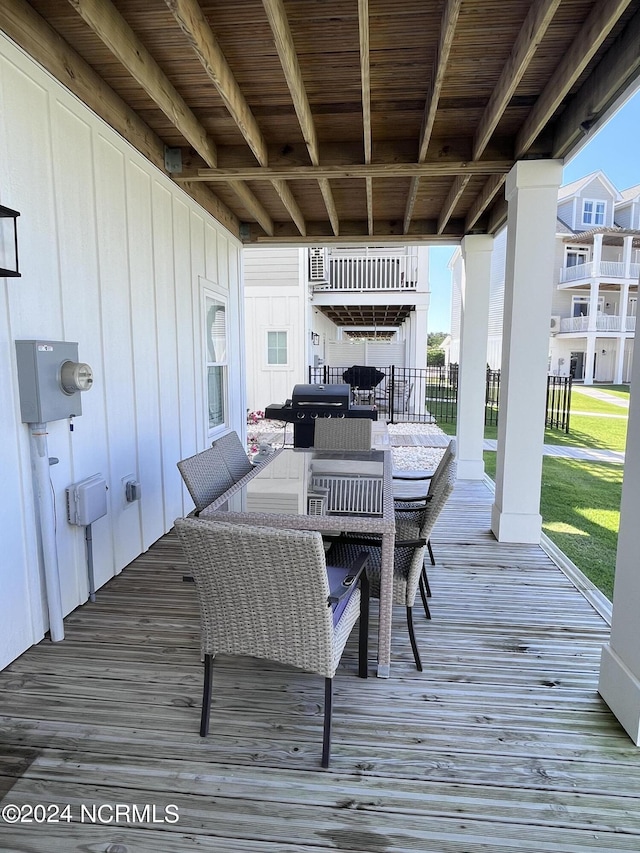 wooden terrace with a yard