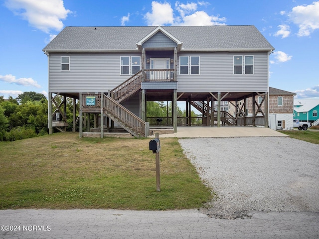 view of front of house featuring a front yard and a carport