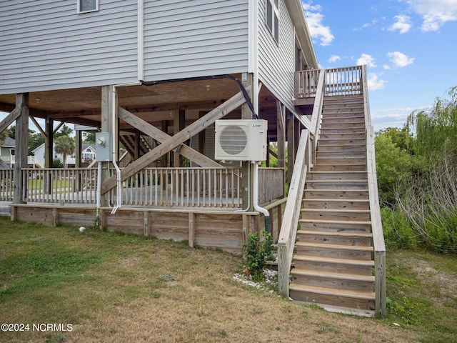 exterior space featuring ac unit and a lawn