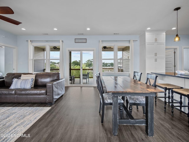 dining room featuring dark hardwood / wood-style flooring and ceiling fan