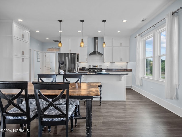 dining space featuring dark hardwood / wood-style floors and sink