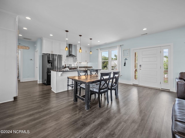 dining room with dark hardwood / wood-style floors