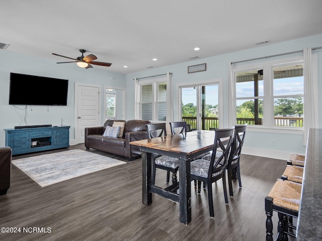 dining space featuring dark hardwood / wood-style floors, plenty of natural light, and ceiling fan