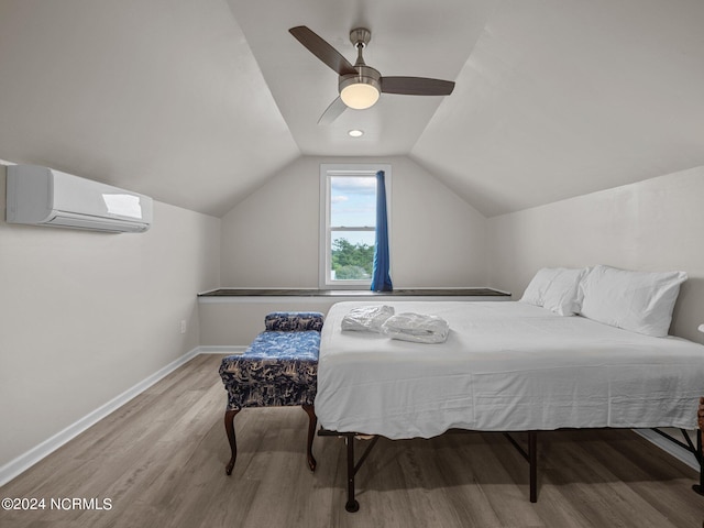 bedroom with an AC wall unit, ceiling fan, wood-type flooring, and lofted ceiling