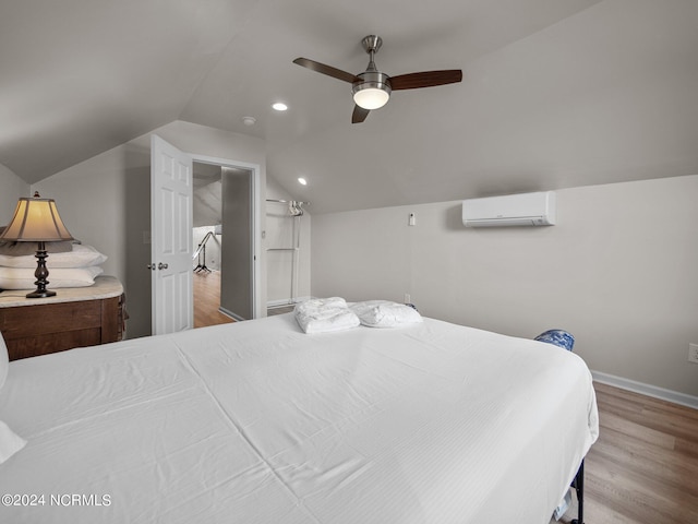 bedroom featuring wood-type flooring, an AC wall unit, ceiling fan, and lofted ceiling