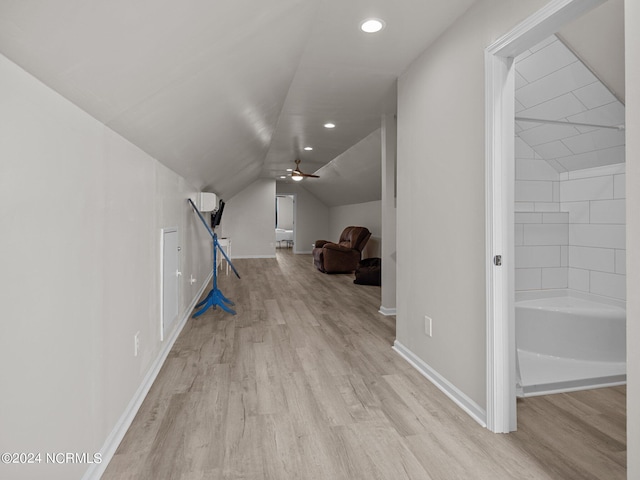 bonus room with vaulted ceiling, light hardwood / wood-style flooring, and ceiling fan