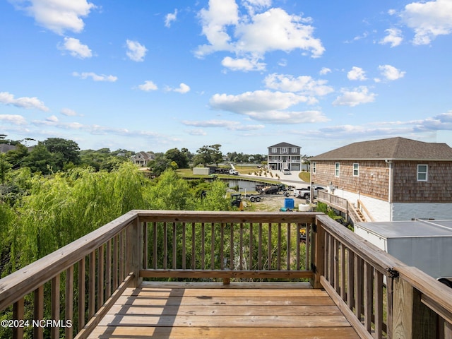 wooden deck with a water view