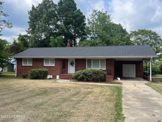 ranch-style house with a carport and a front yard