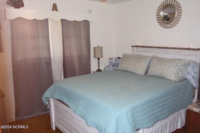 bedroom featuring dark hardwood / wood-style floors