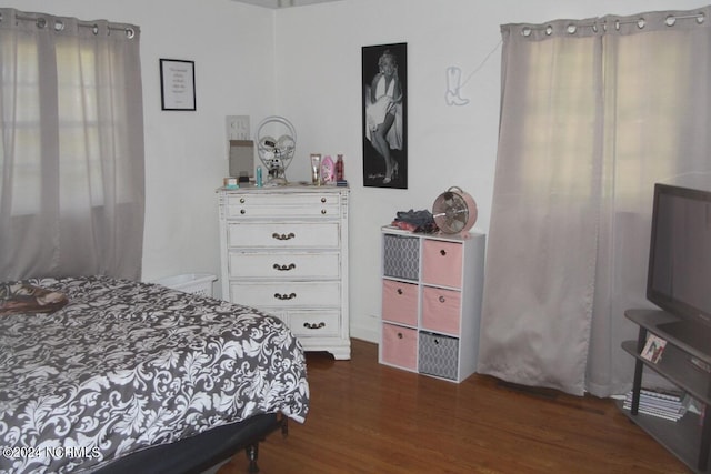 bedroom featuring dark hardwood / wood-style flooring