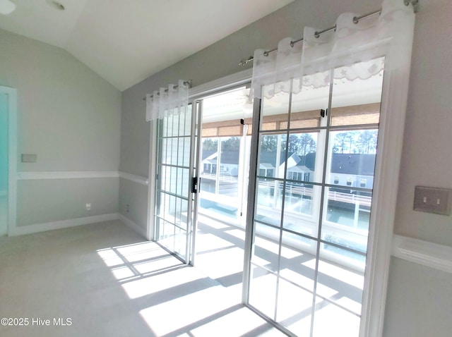 entryway featuring vaulted ceiling